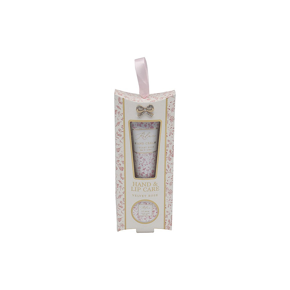 Hand and lip care product in a decorative box on a white background