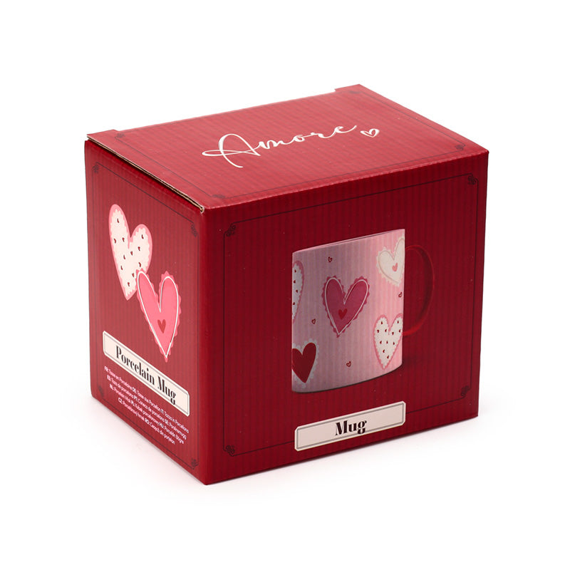 Red mug box with a transparent window displaying a pink mug with heart designs, on a white background.
