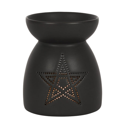 Black wax warmer with star design on a white background