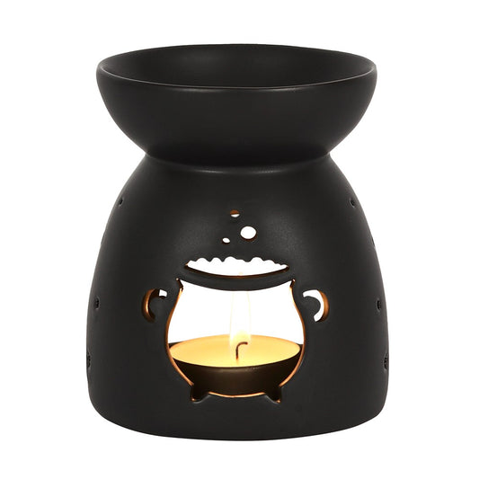 Black wax warmer with cut-out design on a white background