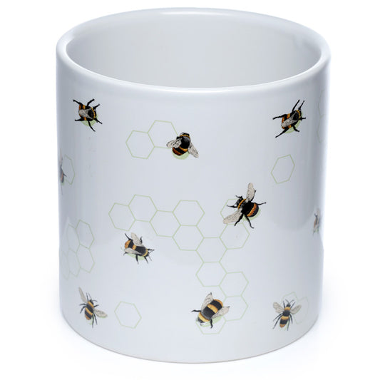 White mug with bee and honeycomb pattern on a white background