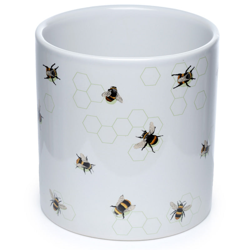 White mug with bee and honeycomb pattern on a white background