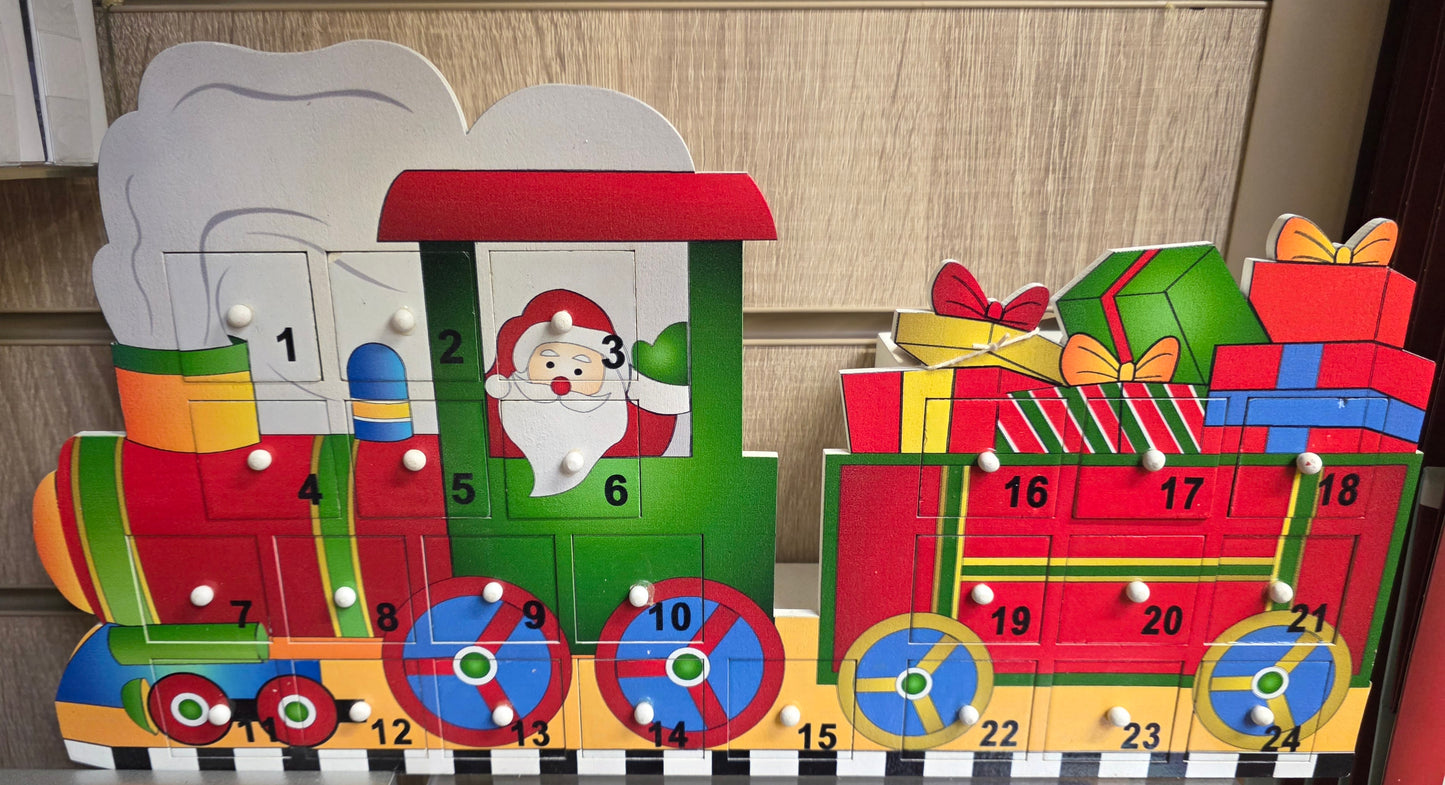 Wooden advent calendar shaped like a train with Santa Claus and presents.