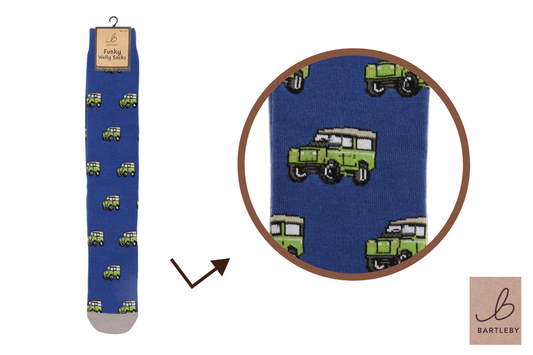 Blue sock with green truck pattern on a white background, featuring Bartlesby branding.