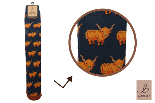 Navy sock with orange highland cow pattern, packaging, and Bartleby brand logo.
