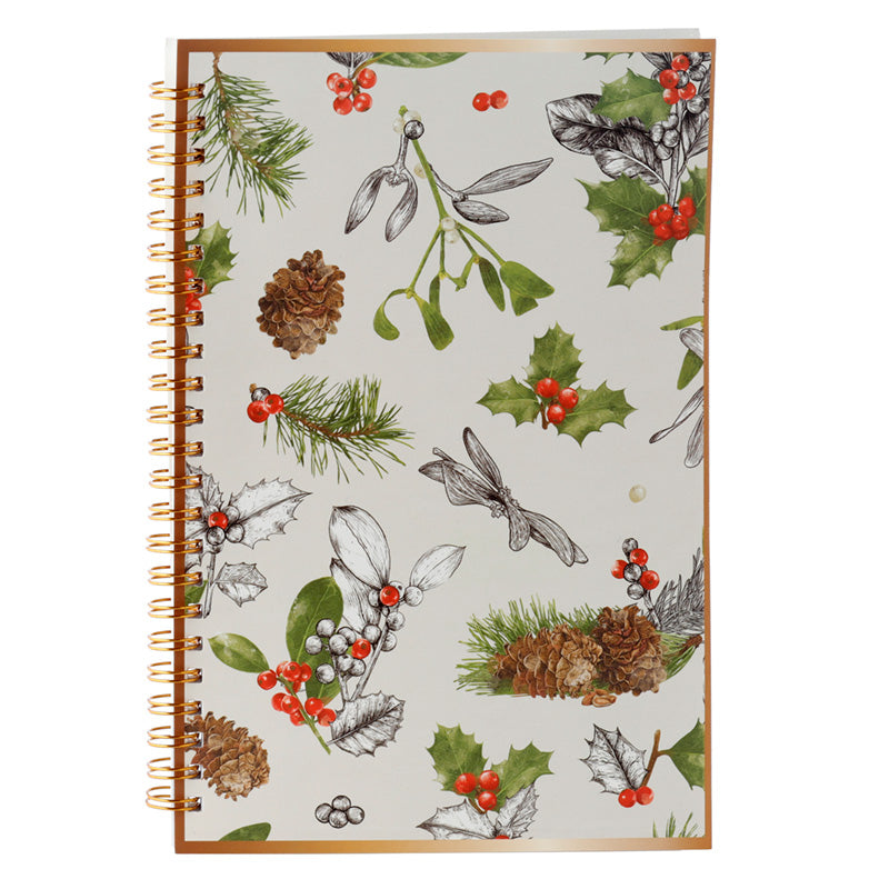 Notebook with Christmas-themed design featuring holly, pine cones, and mistletoe on a white background.