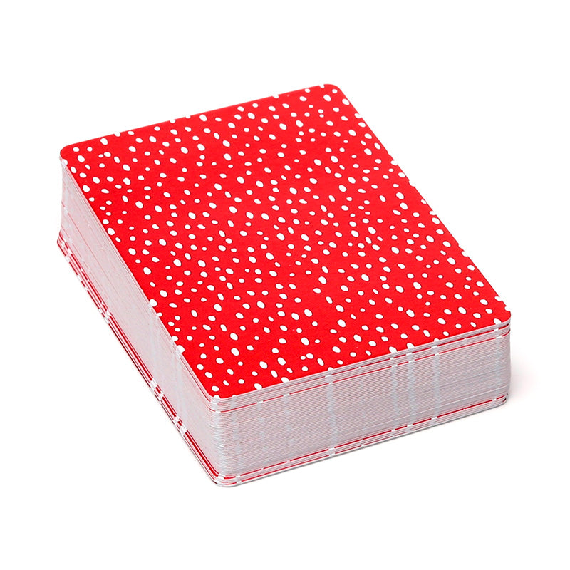 Stack of playing cards with red and white pattern on a white background