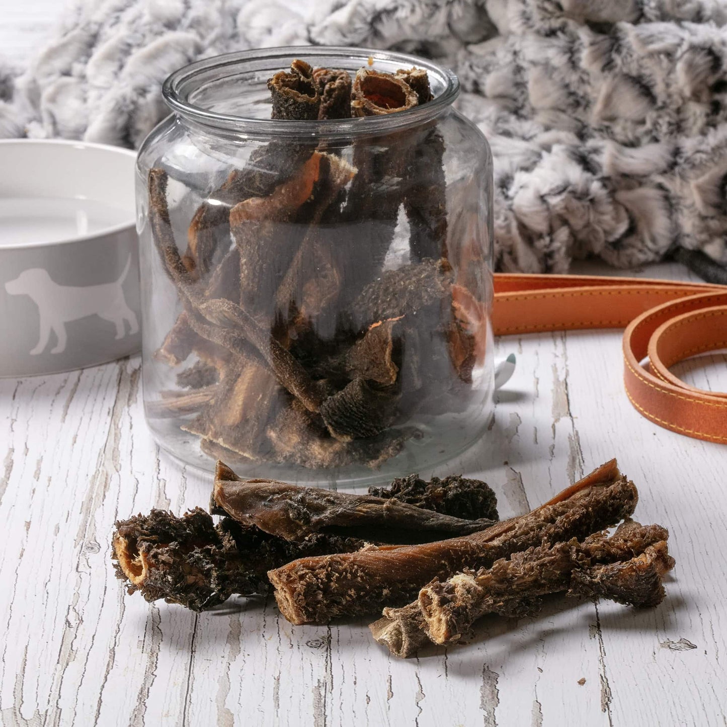 Hollings Tripe Sticks in a glass jar on a table