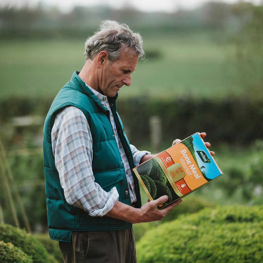 A man holding Westland Bone Meal 4KG