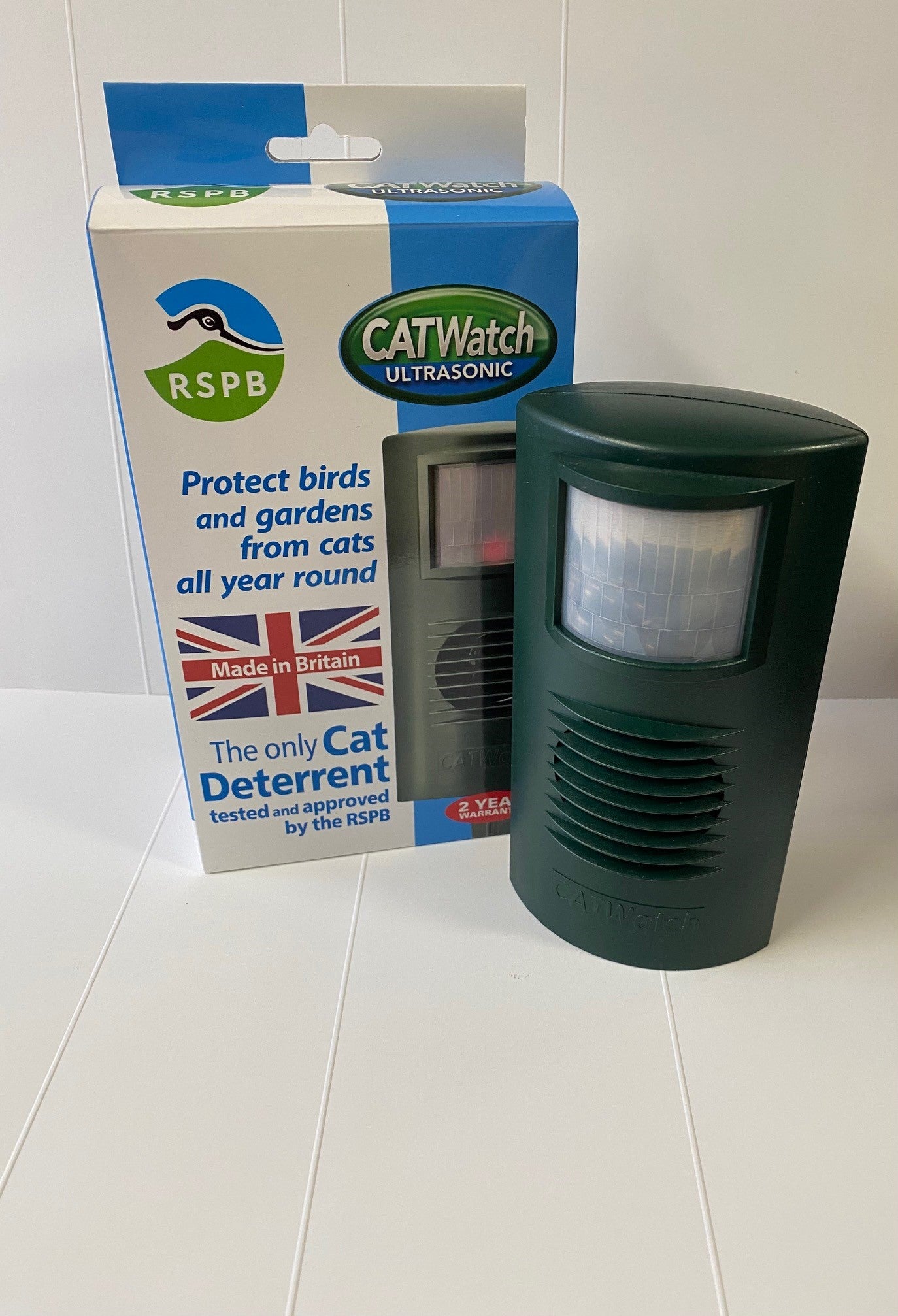 CatWatch ultrasonic device with RSPB packaging on a white surface