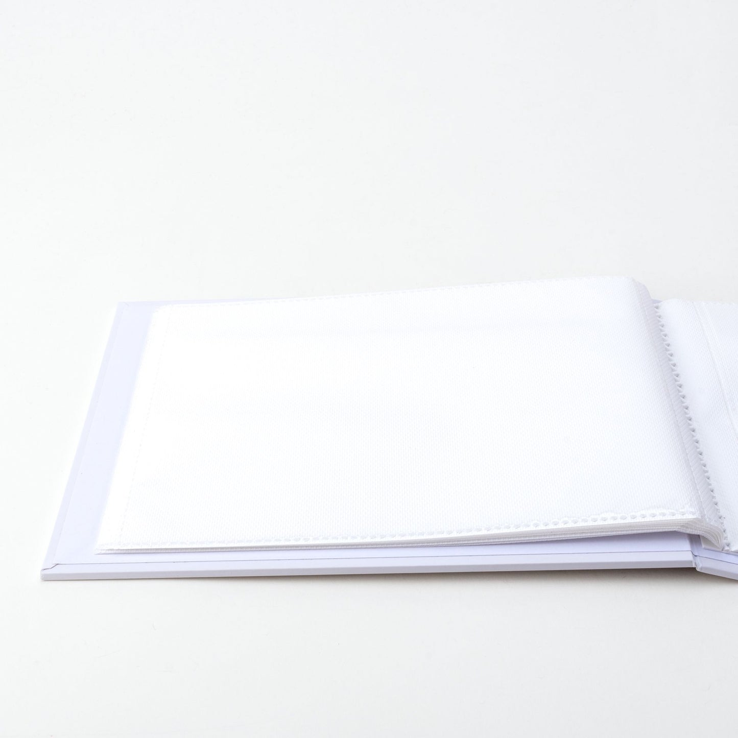 Open book with blank pages on a white background