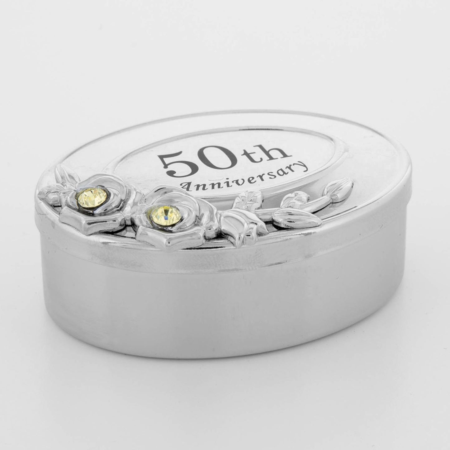 Silver 50th anniversary jewelry box with floral design and gemstones on a white background