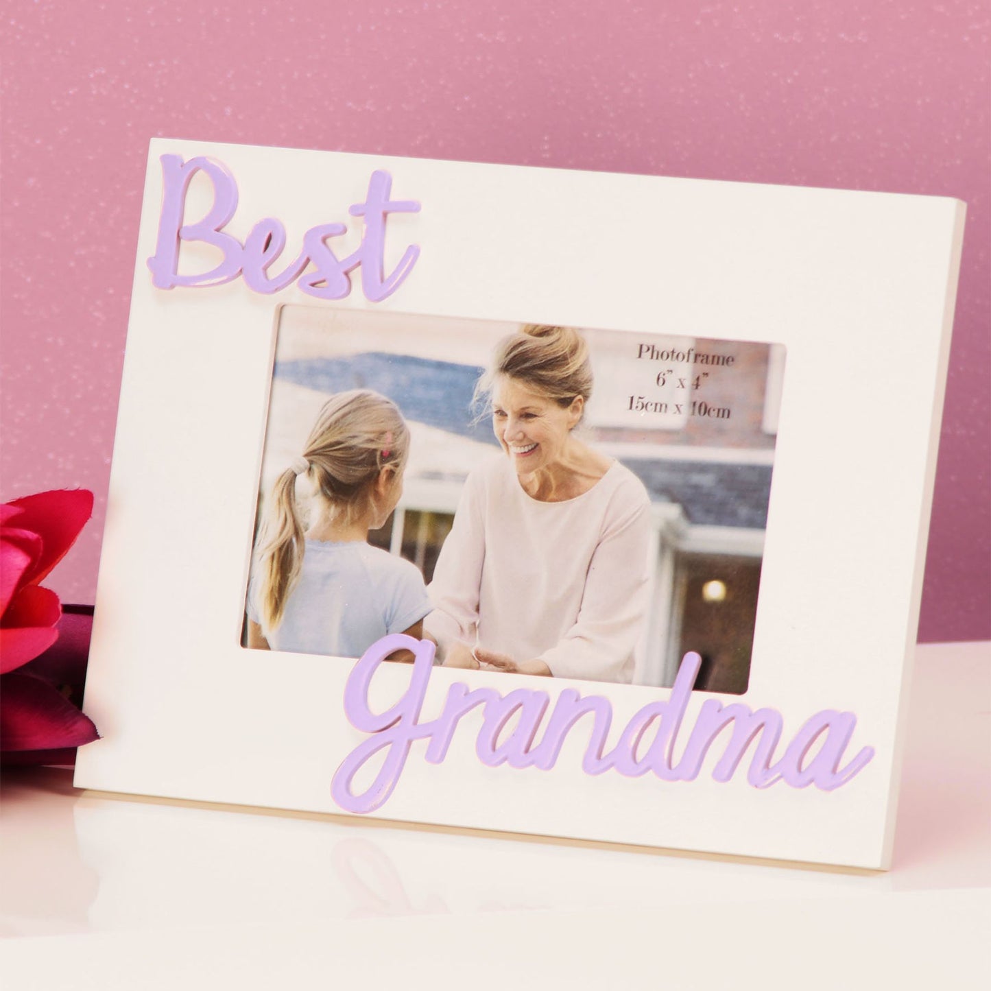 Photo frame with 'Best Grandma' text and a photo of a woman and a child on a pink background