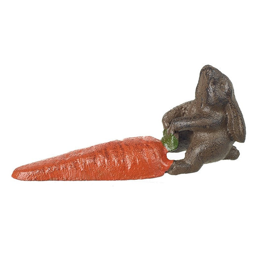 Decorative figurine of a rabbit holding a carrot on a white background