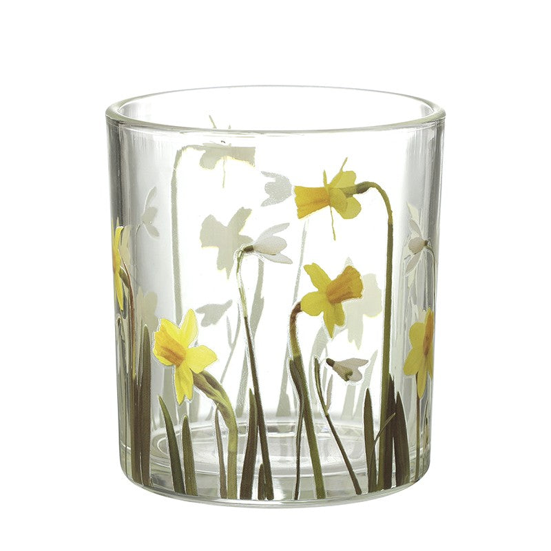 Clear glass candle holder with floral design on a white background