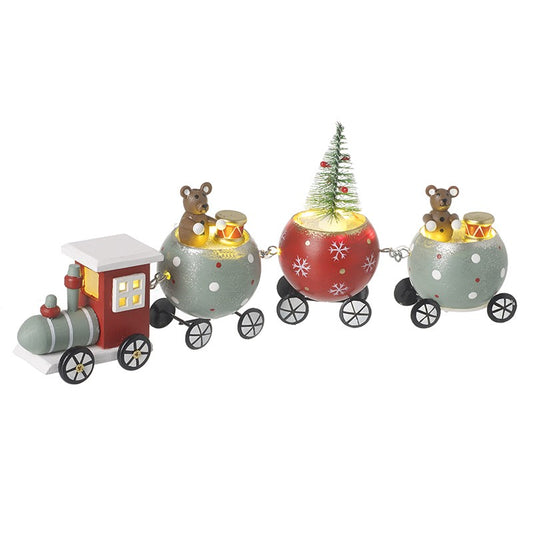 Decorative train set with teddy bears and a Christmas tree on a white background
