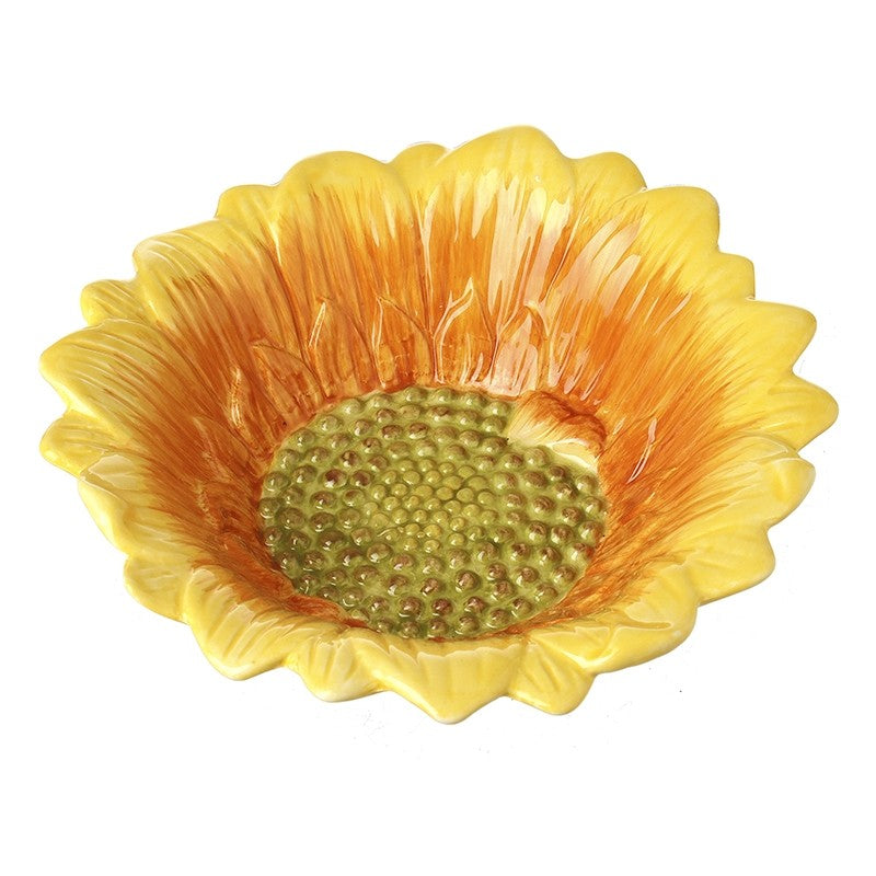 Yellow sunflower-shaped bowl with a textured center on a white background