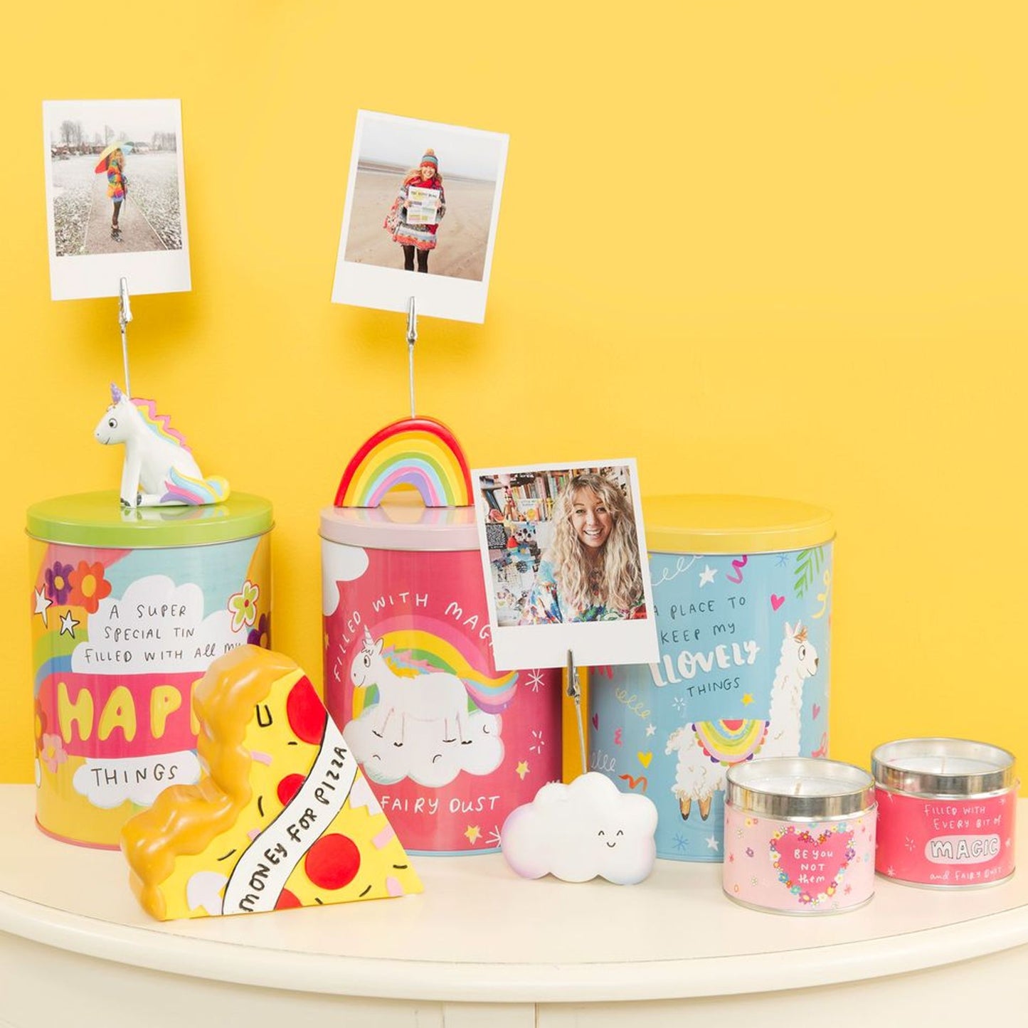 Colorful tins with various designs on a yellow background