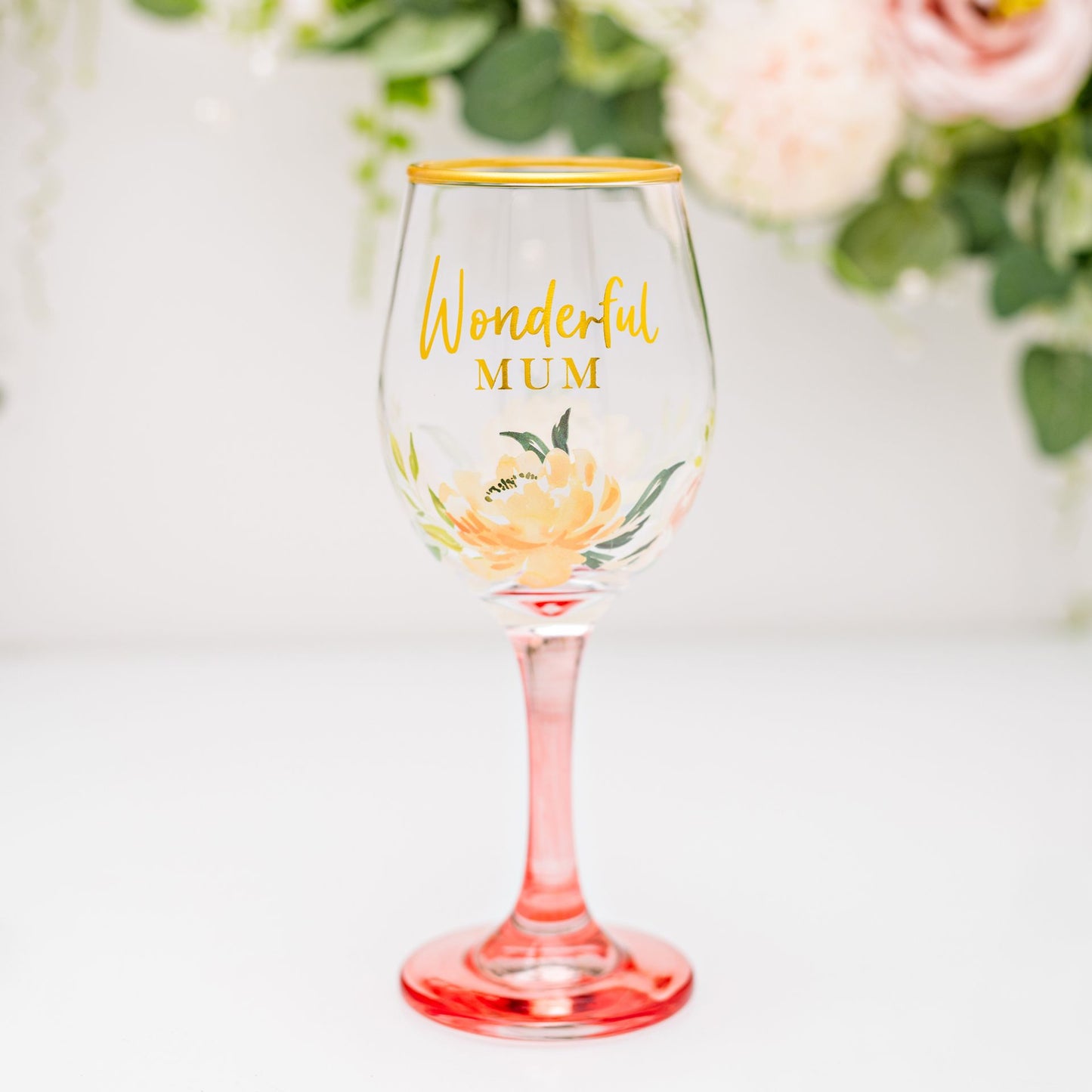 Wine glass with 'Wonderful Mum' text and floral design on a white background