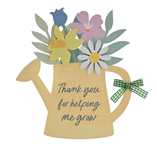 Decorative watering can with flowers and a message on a white background