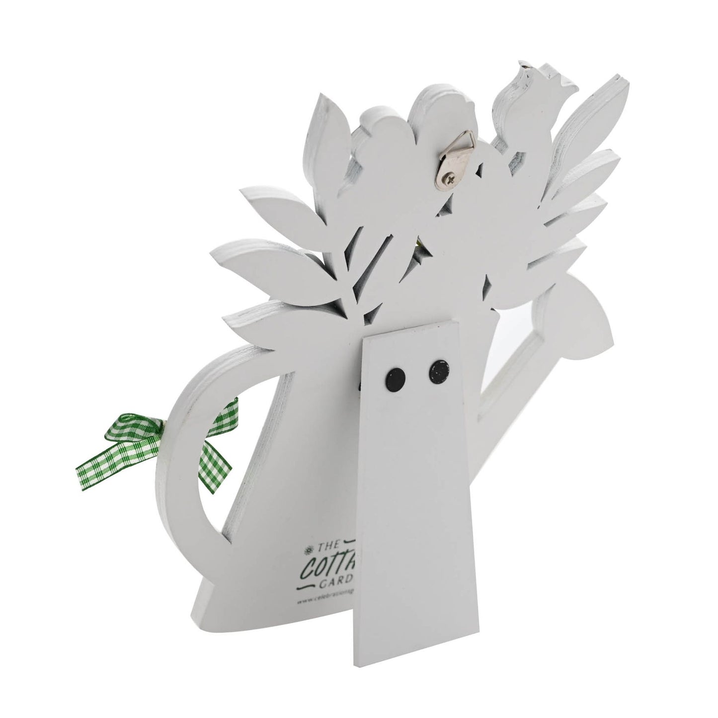 Wooden plaque with cut-out leaves and a small bird on a white background