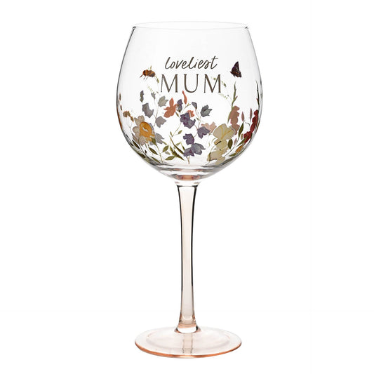 Wine glass with floral design and 'loveliest MUM' text on a white background
