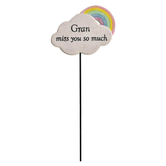 Cloud-shaped sign with rainbow and 'Gran miss you so much' text on a white background