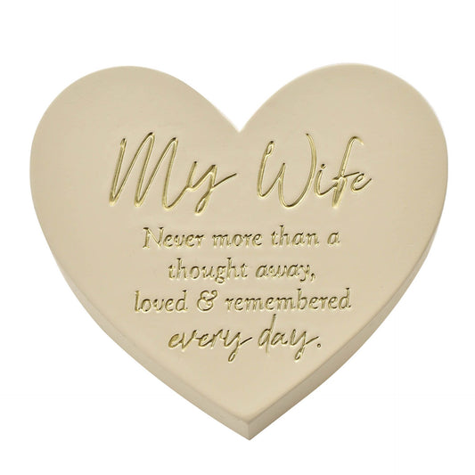 Heart-shaped stone with engraved message 'My Wife Never more than a thought away, loved & remembered every day.' on a white background.