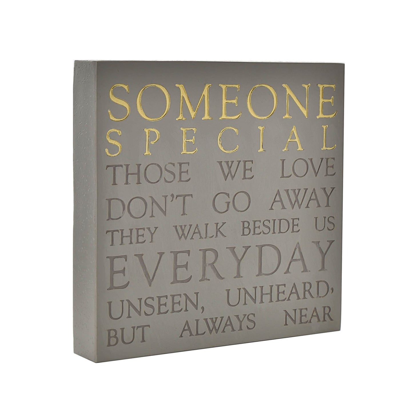 Decorative wall plaque with inspirational quote on a gray background