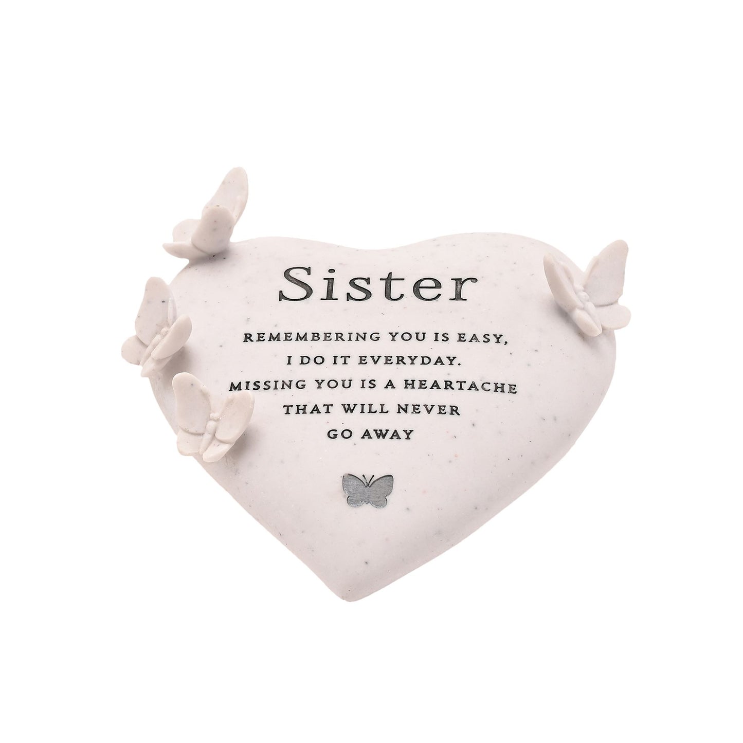 Heart-shaped pillow with butterfly decorations and a sentimental message for sisters on a white background