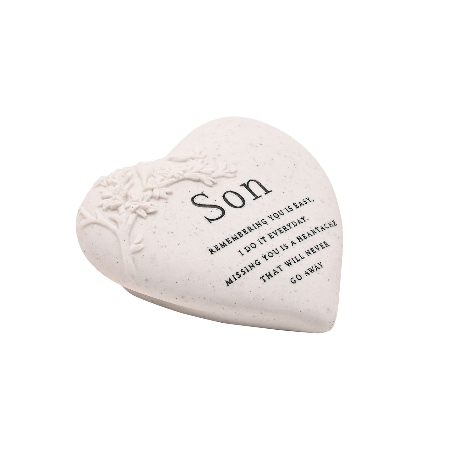 Heart-shaped stone with engraved text on a white background