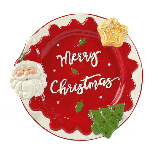 Decorative Christmas plate with Santa Claus, holly leaves, and a star on a white background