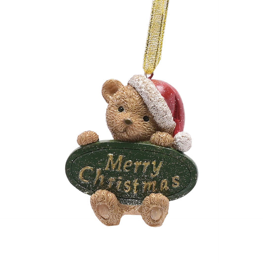 Christmas ornament with a teddy bear holding a 'Merry Christmas' sign on a white background