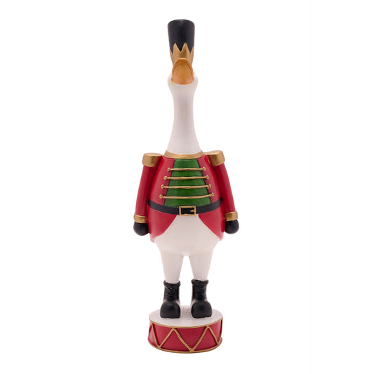 Decorative figurine of a goose in a Nutcracker costume on a white background