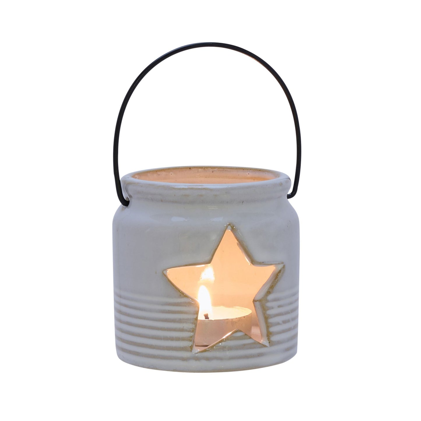 Ceramic lantern with star cutout and lit candle on a white background