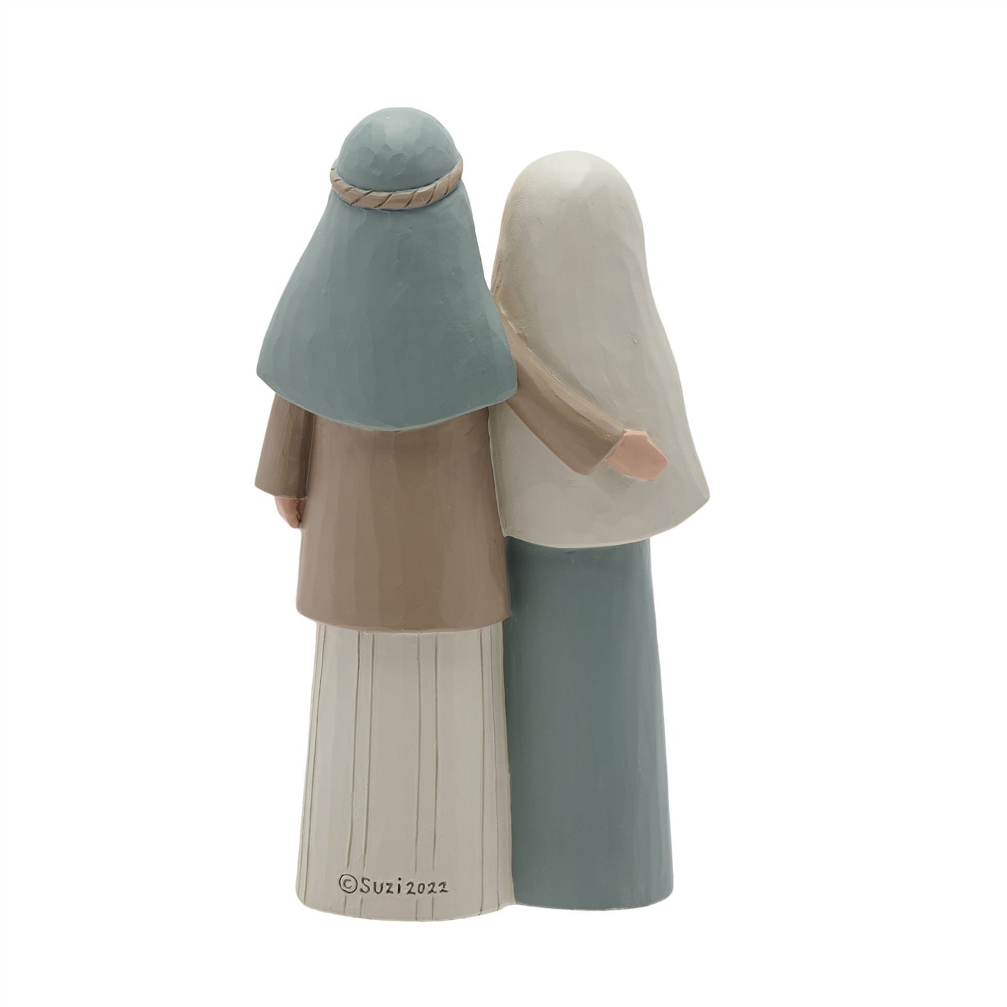 Two figurines wearing headscarves and long dresses on a white background