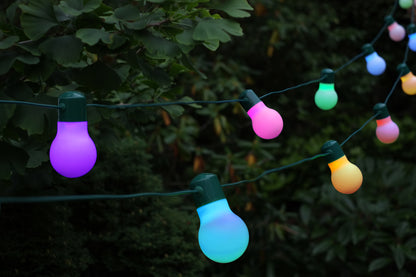 String of colorful outdoor lights against a dark background