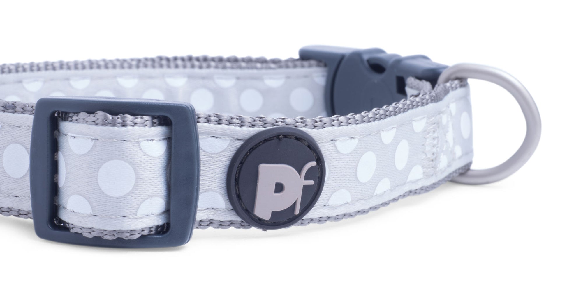 Dog collar with polka dot pattern and branded buckle on a white background