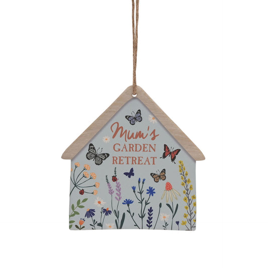 Decorative hanging sign with butterfly designs and 'Mom's Garden Retreat' text on a white background
