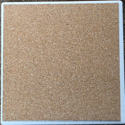 Square tile with a textured beige surface