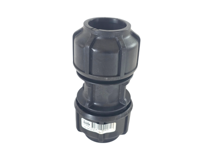 A black plastic plumbing fitting or connector with a ribbed top and a barcode label on the lower section, shown against a plain white background.
