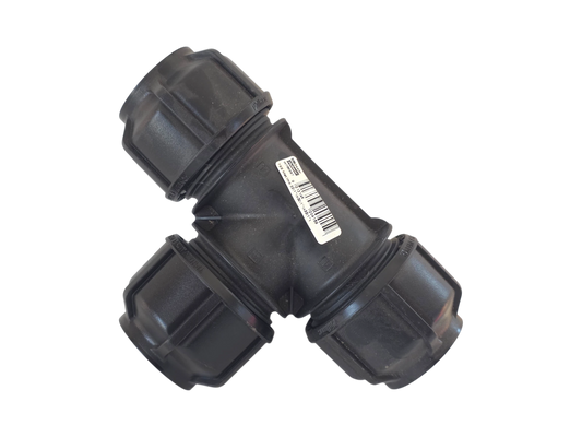 A black plastic T-joint pipe connector with three threaded ends, featuring a white barcode label on one side, isolated on a white background.
