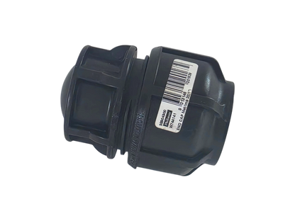 A black plastic plumbing fitting with a white barcode label on the side, photographed on a solid white background.