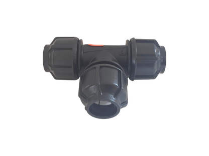 A black plastic T-shaped pipe fitting with a small orange safety switch on top, isolated on a white background.