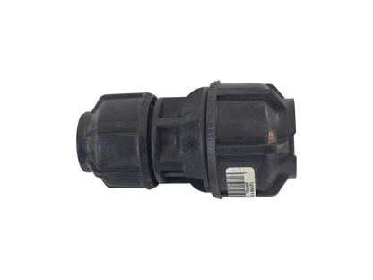 A black plastic plumbing fitting or connector with a barcode label, shown against a plain white background.