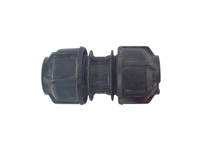 A black plastic male connector fitting with a ribbed outer body and a threaded center section, shown against a plain white background.