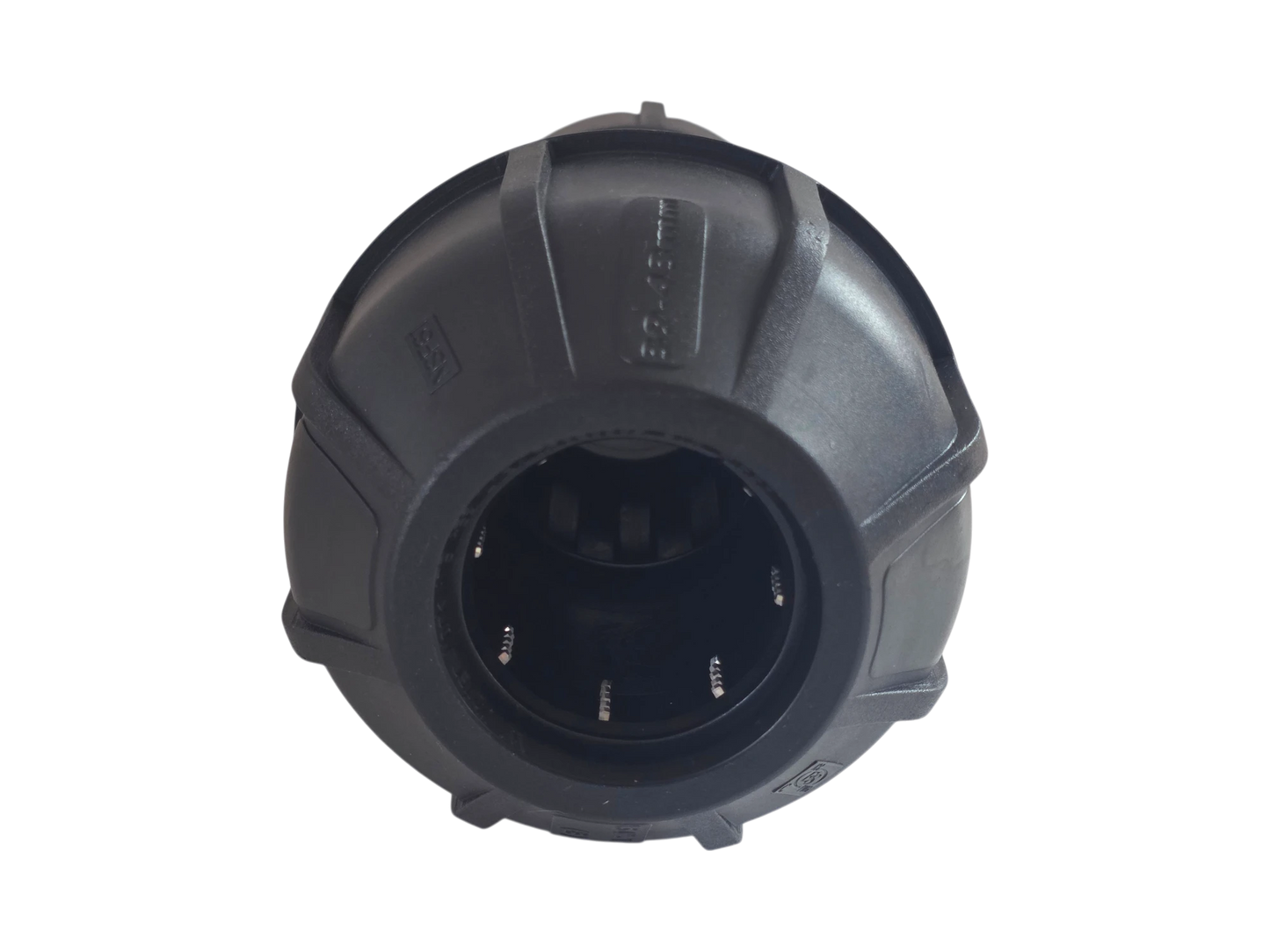 A black plastic circular cap or cover with a textured, rugged design and a hollow center, shown against a plain white background.