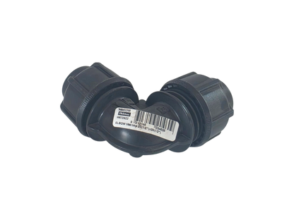 A black plastic 90-degree elbow pipe connector with a white product label in the center, shown on a plain white background.