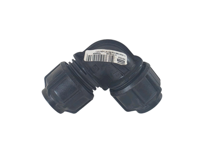 A black plastic 90-degree elbow connector with threaded ends, featuring a white barcode label on the top surface, set against a plain white background.