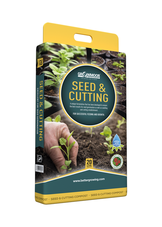 Seed and cutting packaging with a hand holding plants and soil background